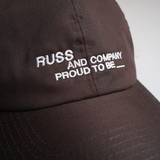 Russ Topi Pria Polo Cap Notes Coklat Tua